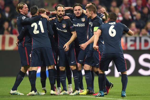 Atletico Madrid's players celebrate scoring during the UEFA Champions League semi-final, second-leg football match between FC Bayern Munich and Atletico Madrid in Munich, southern Germany, on May 3, 2016.  / AFP / CHRISTOF STACHE        (Photo credit should read CHRISTOF STACHE/AFP/Getty Images)