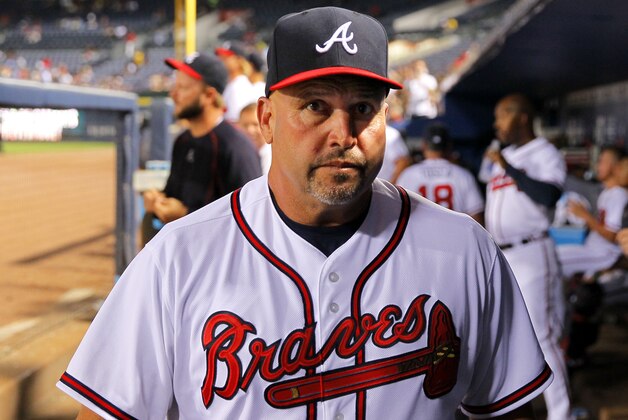 ATLANTA, GA - AUGUST 26: Manager Fredi Gonzalez #33 of the Atlanta Braves walks in the dugout in the sixth inning of the game against the Colorado Rockies on August 26, 2015 at Turner Field in Atlanta, Georgia. The Rockies won the game 6-3. (Photo by Todd Kirkland/Getty Images)