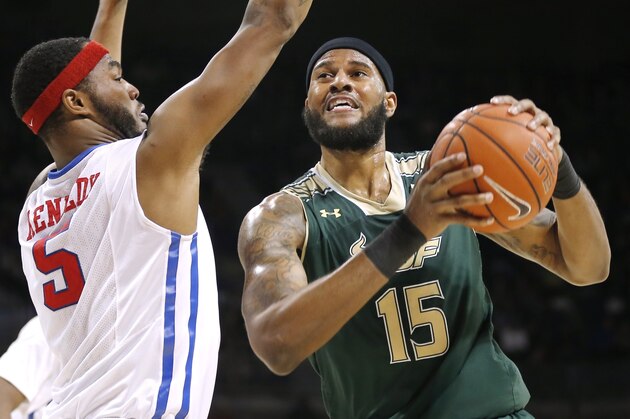 South Florida forward Jaleel Cousins (15) battles SMU forward Markus Kennedy (5) for space during the first half of an NCAA college basketball game Saturday, Jan. 2, 2016, in Dallas. (AP Photo/Brandon Wade)