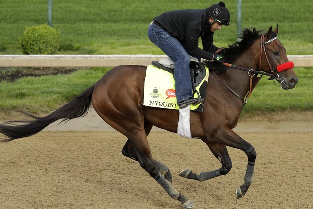 Exercise rider Jonny Garcia rides Kentucky Derby hopeful Nyquist during a workout at Churchill Downs Thursday, May 5, 2016, in Louisville, Ky. The 142nd running of the Kentucky Derby is scheduled for Saturday, May 7. (AP Photo/Charlie Riedel) Exercise rider Jonny Garcia rides Kentucky Derby hopeful Nyquist during a workout at Churchill Downs Thursday, May 5, 2016, in Louisville, Ky. The 142nd running of the Kentucky Derby is scheduled for Saturday, May 7. (AP Photo/Charlie Riedel)