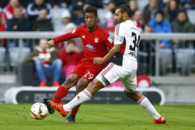 Ingolstadt's Marvin Matip, right, and Bayern’s Kingsley Coman challenge for the ball during the German Bundesliga soccer match between FC Bayern Munich and FC Ingolstadt 04 at the Allianz Arena stadium in Munich, Germany, Saturday, Dec. 12, 2015. (AP Photo/Matthias Schrader)