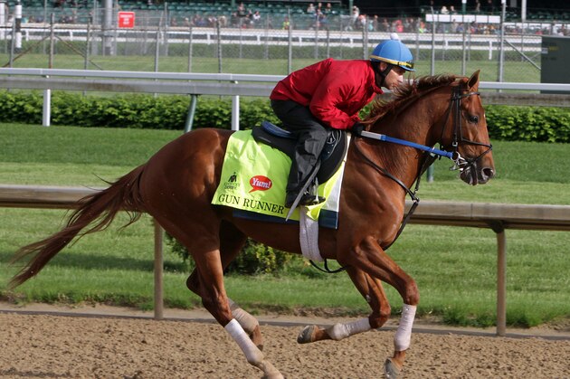 Kentucky Derby entrant Gun Runner, ridden by exercise rider Carlos Rosas, works out at Churchill Downs in Louisville, Ky., Thursday, May 5, 2016. The 142nd Kentucky Derby is Saturday, May 7. (AP Photo/Garry Jones)