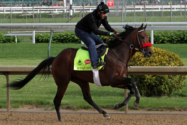 Exercise rider Jonny Garcia rides Kentucky Derby favorite Nyquist during a morning workout at Churchill Downs in Louisville, Ky., Thursday, May 5, 2016. The 142nd Kentucky Derby is Saturday, May 7. (AP Photo/Garry Jones)