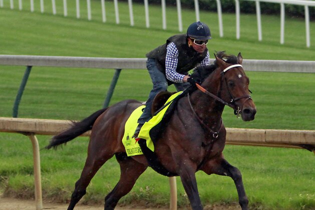 Jockey Kent Desormeaux rides Kentucky Derby hopeful Exaggerator in a workout at Churchill Downs in Louisville, Ky., Saturday, April 30, 2016.  (AP Photo/Garry Jones)