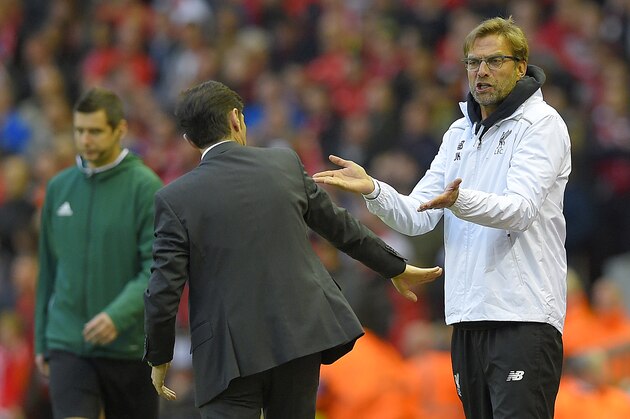 Liverpool's German manager Jurgen Klopp (R) speaks with Villarreal's coach Marcelino Garcia Toral during the UEFA Europa League semi-final second leg football match between Liverpool and Villarreal CF at Anfield in Liverpool, northwest England on May 5, 2016. / AFP / LLUIS GENE        (Photo credit should read LLUIS GENE/AFP/Getty Images)