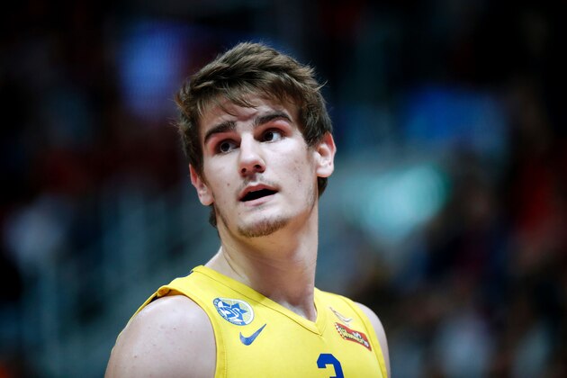 Maccabi Tel Aviv's Croatian player Dragen Bender reacts during a Winner League match between Maccabi Tel Aviv and Hapoel Jerusalem at the Pais Arena in Jerusalem on March 21, 2016.
Dragan Bender's name is not yet well known beyond hardcore basketball fans, but that may soon change. Bender, currently playing for Israeli club Maccabi Tel Aviv, is expected to be highly sought after by US professional basketball teams in the coming months.
/ AFP / THOMAS COEX (Photo credit should read THOMAS COEX/AFP/Getty Images) Maccabi Tel Aviv's Croatian player Dragen Bender reacts during a Winner League match between Maccabi Tel Aviv and Hapoel Jerusalem at the Pais Arena in Jerusalem on March 21, 2016.
Dragan Bender's name is not yet well known beyond hardcore basketball fans, but that may soon change. Bender, currently playing for Israeli club Maccabi Tel Aviv, is expected to be highly sought after by US professional basketball teams in the coming months.
/ AFP / THOMAS COEX (Photo credit should read THOMAS COEX/AFP/Getty Images)