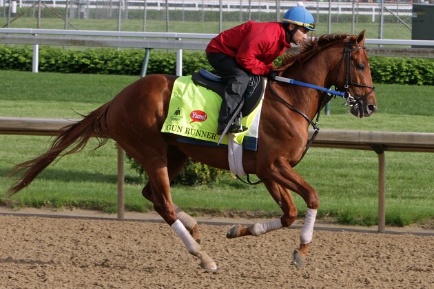 Kentucky Derby entrant Gun Runner, ridden by exercise rider Carlos Rosas, works out at Churchill Downs in Louisville, Ky., Thursday, May 5, 2016. The 142nd Kentucky Derby is Saturday, May 7. (AP Photo/Garry Jones)