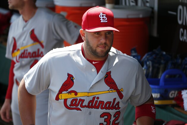 St. Louis Cardinals first baseman Matt Adams (32) walks in the dugout before a baseball game against the St. Louis Cardinals in Pittsburgh, Sunday, April 3, 2016. (AP Photo/Gene J. Puskar)