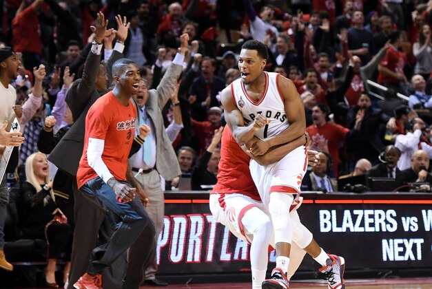 May 3, 2016; Toronto, Ontario, CAN; Toronto Raptors guard Kyle Lowry (7) is greeted by teammates after making a three-point basket to force overtime against Miami Heat in game one of the second round of the NBA Playoffs at Air Canada Centre. The Heat won 102-96. Mandatory Credit: Dan Hamilton-USA TODAY Sports May 3, 2016; Toronto, Ontario, CAN; Toronto Raptors guard Kyle Lowry (7) is greeted by teammates after making a three-point basket to force overtime against Miami Heat in game one of the second round of the NBA Playoffs at Air Canada Centre. The Heat won 102-96. Mandatory Credit: Dan Hamilton-USA TODAY Sports