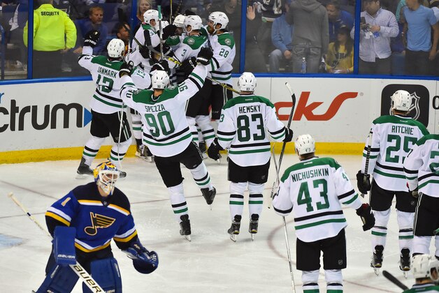 May 5, 2016; St. Louis, MO, USA; Dallas Stars teammates celebrate defeating the St. Louis Blues 3-2 in game four of the second round of the 2016 Stanley Cup Playoffs at Scottrade Center. Mandatory Credit: Jasen Vinlove-USA TODAY Sports