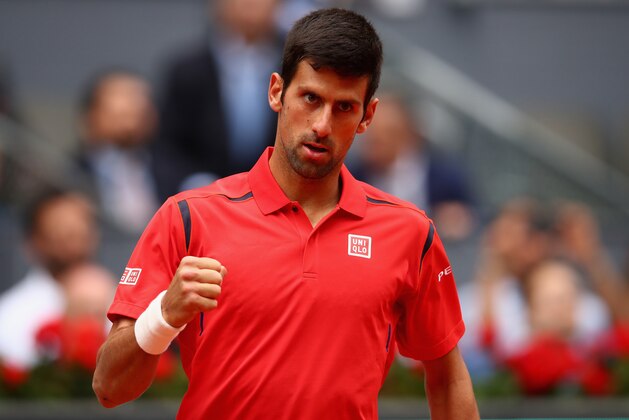 MADRID, SPAIN - MAY 05:  Novak Djokovic of Serbia celebrates a point against Roberto Bautista Agut of Spain in their third round match during day six of the Mutua Madrid Open tennis tournament at the Caja Magica  on May 05, 2016 in Madrid,Spain  (Photo by Clive Brunskill/Getty Images)