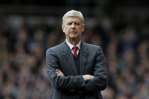Arsenal manager Arsene Wenger closes his eyes during the English Premier League soccer match between West Ham United and Arsenal at Upton Park stadium in London, Saturday April 9, 2016. (AP Photo/Tim Ireland)