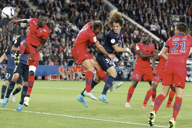 PARIS, FRANCE - AUGUST 16: David Luiz
of Paris Saint-Germain kick the ball over the defense during the French  Ligue 1 between Paris Saint-Germain FC and GFC Ajaccio at Parc Des Princes on August 16, 2015 in Paris, France.  (Photo by Xavier Laine/Getty Images)