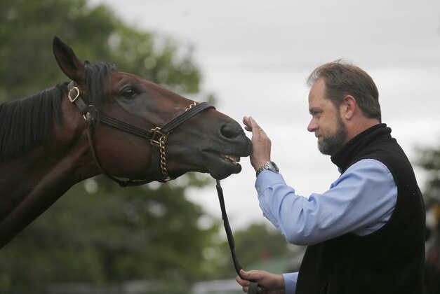 May 3, 2016; Louisville, KY, USA; Horse trainer Doug O'Neill with Kentucky Derby favorite Nyquist after workouts in advance of the 2016 Kentucky Derby at Churchill Downs. Mandatory Credit: Pat McDonogh/Louisville Courier-Journal via USA TODAY NETWORK