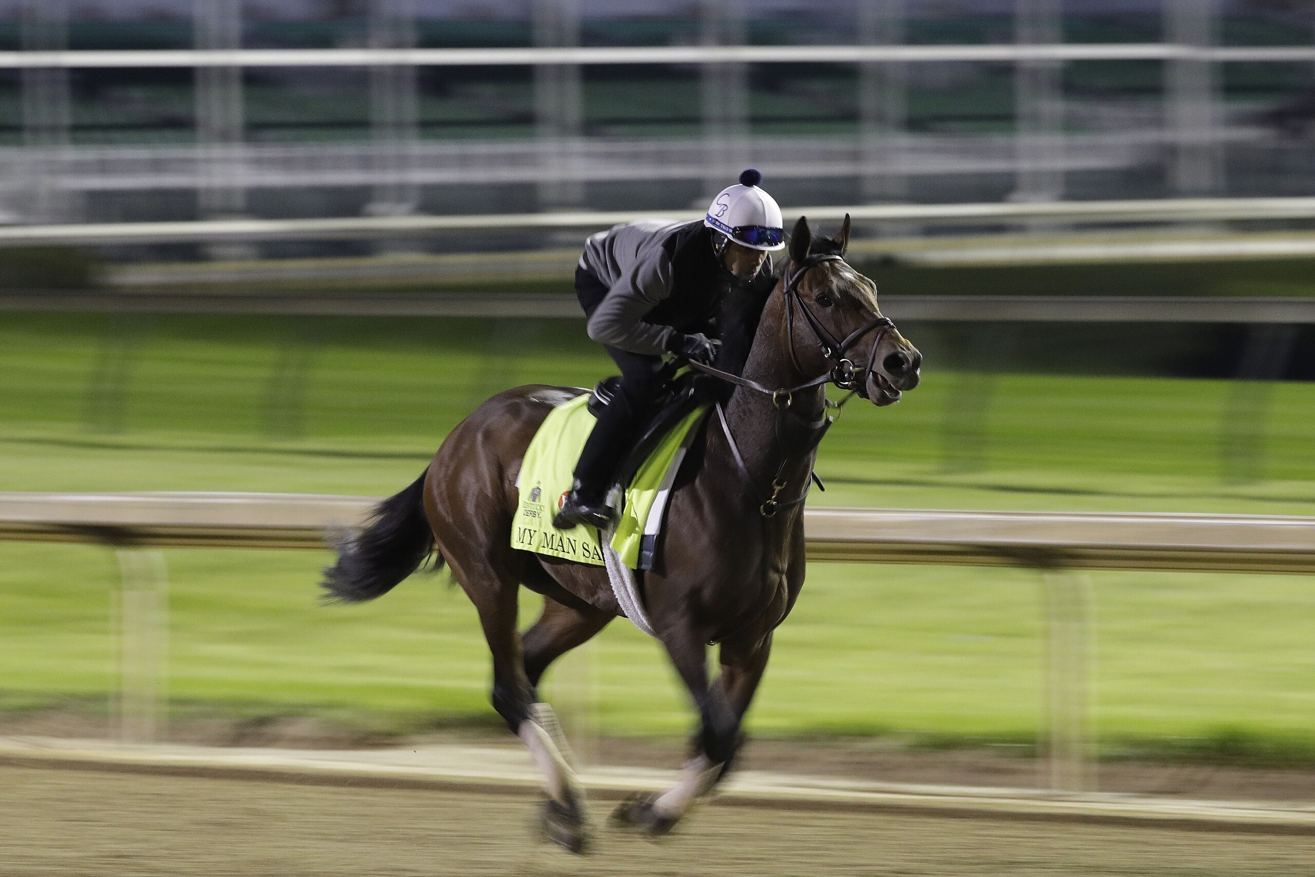 Exercise rider Daniel Bernardini takes Kentucky Derby entrant My Man Sam for a workout at Churchill Downs Friday, May 6, 2016, in Louisville, Ky. The 142nd running of the Kentucky Derby is scheduled for Saturday, May 7. (AP Photo/Charlie Riedel)