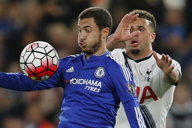 Chelsea's Eden Hazard, left, vies for the ball with Tottenham's Kyle Walker during the English Premier League soccer match between Chelsea and Tottenham Hotspur at Stamford Bridge stadium in London, Monday, May 2, 2016. (AP Photo/Frank Augstein)