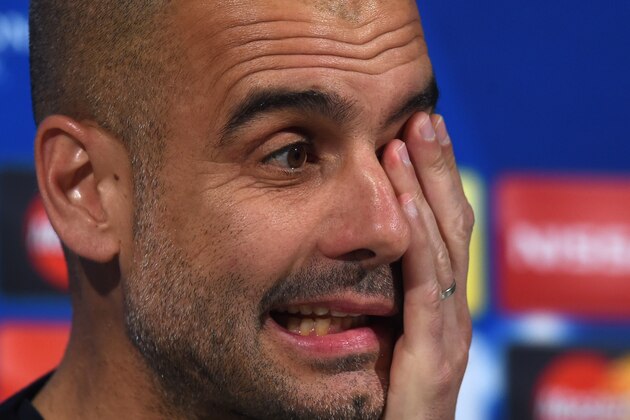 Bayern Munich's Spanish headcoach Pep Guardiola addresses a press conference on the eve of the Champions League semi final, second-leg football match between Bayern Munich and Atletico Madrid at the arena in Munich, southern Germany, on May 2, 2016. / AFP / CHRISTOF STACHE        (Photo credit should read CHRISTOF STACHE/AFP/Getty Images)