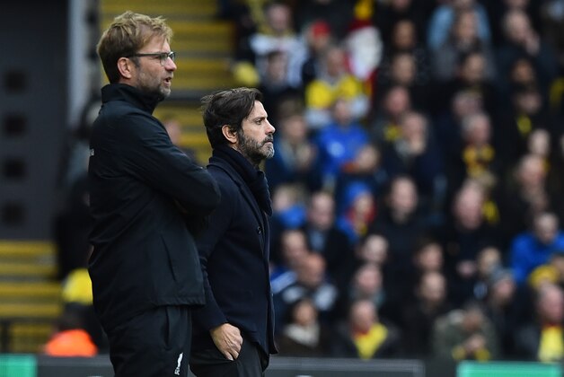 Watford's Spanish manager Quique Sanchez Flores (R) and Liverpool's German manager Jurgen Klopp (L) watch from the touchline during the English Premier League football match between Watford and Liverpool at Vicarage Road Stadium in Watford, north of London on December 20, 2015.  AFP PHOTO / BEN STANSALL

RESTRICTED TO EDITORIAL USE. NO USE WITH UNAUTHORIZED AUDIO, VIDEO, DATA, FIXTURE LISTS, CLUB/LEAGUE LOGOS OR 'LIVE' SERVICES. ONLINE IN-MATCH USE LIMITED TO 75 IMAGES, NO VIDEO EMULATION. NO USE IN BETTING, GAMES OR SINGLE CLUB/LEAGUE/PLAYER PUBLICATIONS. / AFP / BEN STANSALL        (Photo credit should read BEN STANSALL/AFP/Getty Images)