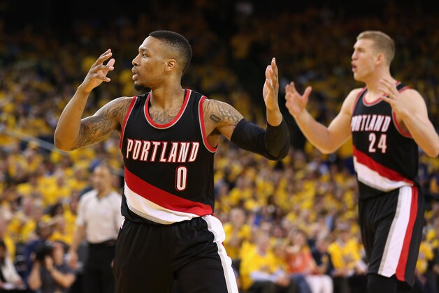 OAKLAND, CA - MAY 03:  Damian Lillard #0 and Mason Plumlee #24 of the Portland Trail Blazers react during their loss to the Golden State Warriors in Game Two of the Western Conference Semifinals during the 2016 NBA Playoffs on May 3, 2016 at Oracle Arena in Oakland, California.  NOTE TO USER: User expressly acknowledges and agrees that, by downloading and or using this photograph, User is consenting to the terms and conditions of the Getty Images License Agreement.  (Photo by Ezra Shaw/Getty Images)