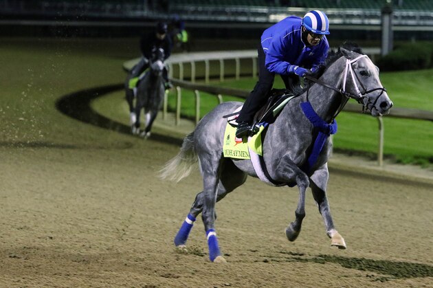 Exercise rider Miguel Jaime rides Kentucky Derby entrant Mohaymen for a morning workout at Churchill Downs Friday, May 6, 2016, in Louisville, Ky. The 142nd running of the Kentucky Derby is scheduled for Saturday, May 7. (AP Photo/Garry Jones)