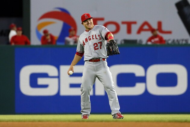 Los Angeles Angels center fielder Mike Trout (27) smiles as he warms up before a baseball game against the Texas Rangers on Saturday, April 30, 2016, in Arlington, Texas. (AP Photo/Tony Gutierrez)