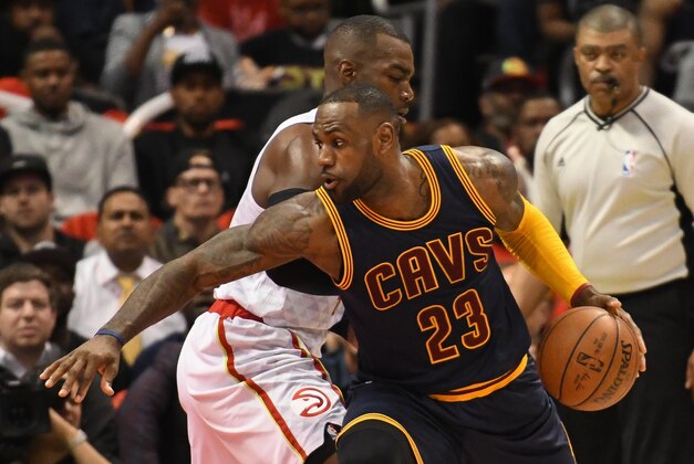 May 6, 2016; Atlanta, GA, USA; Cleveland Cavaliers forward LeBron James (23) works against Atlanta Hawks forward Paul Millsap (4) during the first half in game three of the second round of the NBA Playoffs at Philips Arena. Mandatory Credit: Dale Zanine-USA TODAY Sports