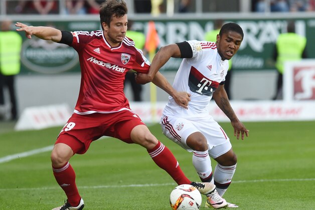Ingolstadt's Israeli defender Almog Cohen (L) Bayern Munich's Brazilian midfielder Douglas Costa vie for the ball during the German first division Bundesliga football match between FC Ingolstadt 04 and FC Bayern Munich, at the Audi Sportpark in Ingolstadt, southern Germany, on May 7, 2016. / AFP / CHRISTOF STACHE / RESTRICTIONS: DURING MATCH TIME: DFL RULES TO LIMIT THE ONLINE USAGE TO 15 PICTURES PER MATCH AND FORBID IMAGE SEQUENCES TO SIMULATE VIDEO. == RESTRICTED TO EDITORIAL USE == FOR FURTHER QUERIES PLEASE CONTACT DFL DIRECTLY AT + 49 69 650050
(Photo credit should read CHRISTOF STACHE/AFP/Getty Images) Ingolstadt's Israeli defender Almog Cohen (L) Bayern Munich's Brazilian midfielder Douglas Costa vie for the ball during the German first division Bundesliga football match between FC Ingolstadt 04 and FC Bayern Munich, at the Audi Sportpark in Ingolstadt, southern Germany, on May 7, 2016. / AFP / CHRISTOF STACHE / RESTRICTIONS: DURING MATCH TIME: DFL RULES TO LIMIT THE ONLINE USAGE TO 15 PICTURES PER MATCH AND FORBID IMAGE SEQUENCES TO SIMULATE VIDEO. == RESTRICTED TO EDITORIAL USE == FOR FURTHER QUERIES PLEASE CONTACT DFL DIRECTLY AT + 49 69 650050
(Photo credit should read CHRISTOF STACHE/AFP/Getty Images)