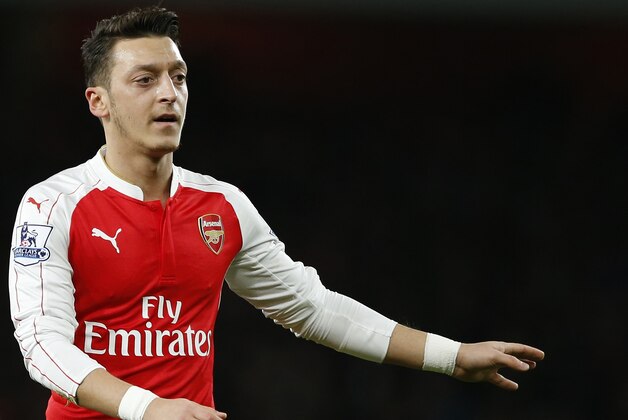 Arsenal's Mesut Ozil gestures during the English Premier League soccer match between Arsenal and Manchester City at the Emirates stadium in London, Monday, Dec. 21, 2015. (AP Photo/Alastair Grant)