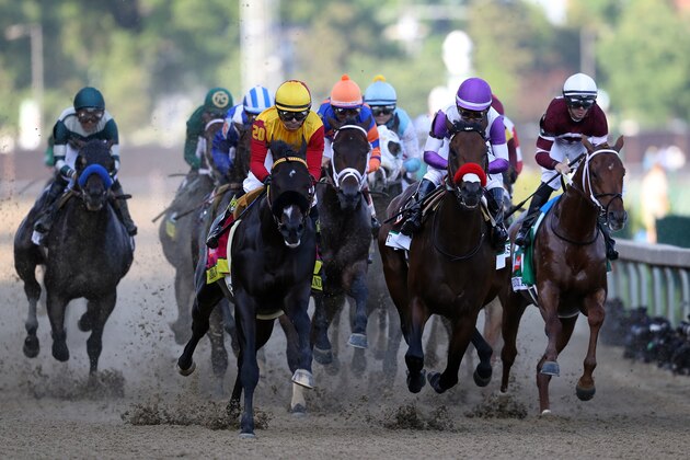 LOUISVILLE, KY - MAY 07:  Danzing Candy #20, ridden by Mike E. Smith, and Nyquist #13, ridden by Mario Gutierrez, lead the field during the 142nd running of the Kentucky Derby at Churchill Downs on May 07, 2016 in Louisville, Kentucky.  (Photo by Rob Carr/Getty Images)