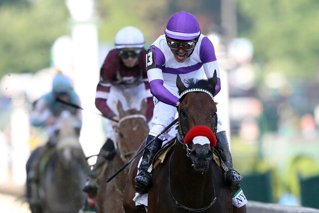 LOUISVILLE, KY - MAY 07:  Nyquist #13, ridden by Mario Gutierrez, crosses the finish line during the 142nd running of the Kentucky Derby at Churchill Downs on May 07, 2016 in Louisville, Kentucky.  (Photo by Rob Carr/Getty Images)