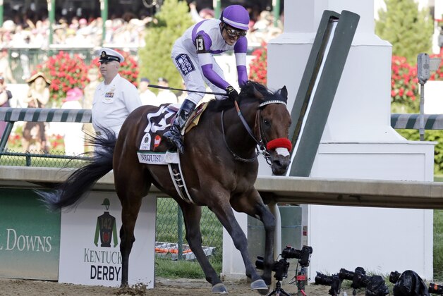 Mario Guitierrez celebrates after riding Nyquist to victory during the 142nd running of the Kentucky Derby horse race at Churchill Downs Saturday, May 7, 2016, in Louisville, Ky. (AP Photo/Garry Jones)