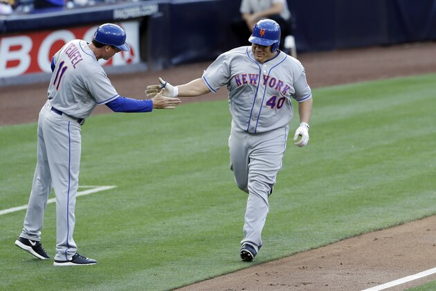 New York Mets' Bartolo Colon (40) is greeted by third base coach Tim Teufel after hitting a home run during the first inning of a baseball game against the San Diego Padres, Saturday, May 7, 2016, in San Diego. (AP Photo/Gregory Bull)