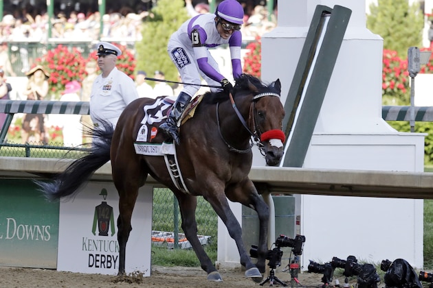 Mario Gutierrez celebrates after riding Nyquist to victory during the 142nd running of the Kentucky Derby horse race at Churchill Downs Saturday, May 7, 2016, in Louisville, Ky. (AP Photo/Garry Jones)
