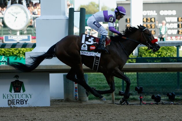 LOUISVILLE, KY - MAY 07:  Mario Gutierrez celebrates atop Nyquist #13 after crossing the finish line to win the 142nd running of the Kentucky Derby at Churchill Downs on May 07, 2016 in Louisville, Kentucky.  (Photo by Dylan Buell/Getty Images)