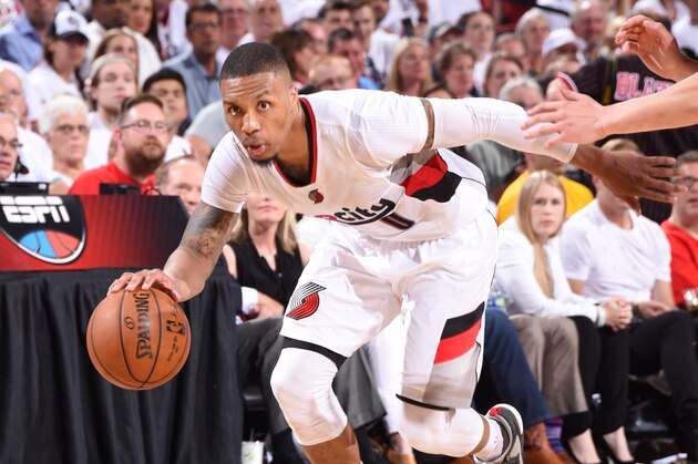 PORTLAND, OR - MAY 7:  Damian Lillard #0 of the Portland Trail Blazers handles the ball against the Golden State Warriors in Game Three of the Western Conference Semifinals during the 2016 NBA Playoffs on May 7, 2016 at the Moda Center in Portland, Oregon. NOTE TO USER: User expressly acknowledges and agrees that, by downloading and or using this Photograph, user is consenting to the terms and conditions of the Getty Images License Agreement. Mandatory Copyright Notice: Copyright 2016 NBAE (Photo by Andrew D. Bernstein/NBAE via Getty Images)