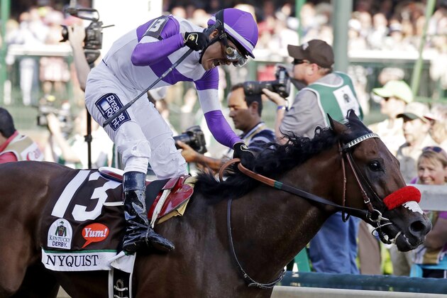 Mario Gutierrez celebrates after riding Nyquist to victory during the 142nd running of the Kentucky Derby horse race at Churchill Downs Saturday, May 7, 2016, in Louisville, Ky. (AP Photo/Garry Jones)