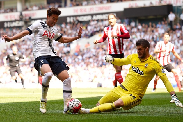LONDON, ENGLAND - MAY 08:  Son Heung-Min of Tottenham Hotspur beats Fraser Forster of Southampton on his way to scoring the opening goal  during the Barclays Premier League match between Tottenham Hotspur and Southampton at White Hart Lane on May 8, 2016 in London, England.  (Photo by Mike Hewitt/Getty Images)