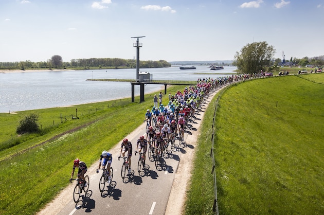 Riders cross the Waaldijk next to the Waal river near Doornenburg, during the third stage of the Giro d'Italia cycling race between Nijmegen and Arnhem, on May 8, 2016.  / AFP / ANP / Vincent Jannink / Netherlands OUT        (Photo credit should read VINCENT JANNINK/AFP/Getty Images)