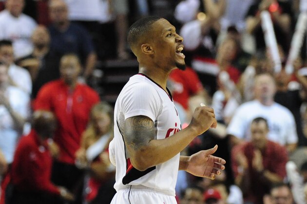 PORTLAND, OR - MAY 7: Damian Lillard #0 of the Portland Trail Blazers reacts after hitting a shot late in the fourth quarter of Game Three of the Western Conference Semifinals against the Golden State Warriors during the 2016 NBA Playoffs at the Moda Center on May 7, 2016 in Portland, Oregon. The Blazers won 120-108. NOTE TO USER: User expressly acknowledges and agrees that by downloading and/or using this photograph, user is consenting to the terms and conditions of the Getty Images License Agreement.  (Photo by Steve Dykes/Getty Images)