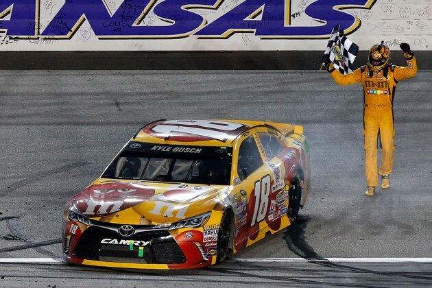 KANSAS CITY, KS - MAY 07:  Kyle Busch, driver of the #18 M&M's Red Nose Toyocta, celebrates after winning the NASCAR Sprint Cup Series Go Bowling 400 at Kansas Speedway on May 7, 2016 in Kansas City, Kansas.  (Photo by Brian Lawdermilk/Getty Images)
