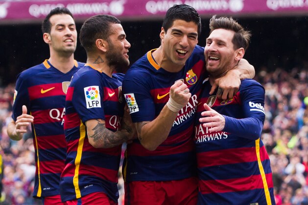BARCELONA, SPAIN - MAY 08:  (L-R) Sergio Busquets, Dani Alves and Luis Suarez celebrate with their teammate Lionel Messi after scoring the opening goal during the La Liga match between FC Barcelona and RCD Espanyol at Camp Nou on May 8, 2016 in Barcelona, Spain.  (Photo by Alex Caparros/Getty Images)