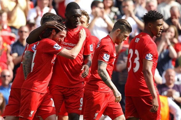 Liverpool's Welsh midfielder Joe Allen (L) celebrates scoring his team's first goal with Liverpool's Zaire-born Belgian striker Christian Benteke (C) and teammates during the English Premier League football match between Liverpool and Watford at Anfield in Liverpool, north west England on May 8, 2016. / AFP / LINDSEY PARNABY / RESTRICTED TO EDITORIAL USE. No use with unauthorized audio, video, data, fixture lists, club/league logos or 'live' services. Online in-match use limited to 75 images, no video emulation. No use in betting, games or single club/league/player publications.  /         (Photo credit should read LINDSEY PARNABY/AFP/Getty Images)