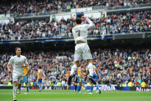 MADRID, SPAIN - MAY 08:  Cristiano Ronaldo of Real Madrid celebrates his team's opening goal with Lucas Vazquez during the La Liga match between Real Madrid CF and Valencia CF at Estadio Santiago Bernabeu on May 8, 2016 in Madrid, Spain.  (Photo by Denis Doyle/Getty Images)