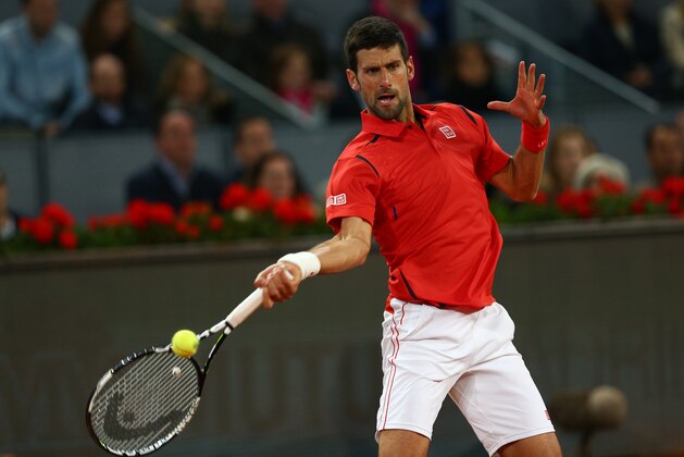 MADRID, SPAIN - MAY 07:  Novak Djokovic of Serbia plays a forehand during his straight sets victory against Kei Nishikori of Japan in their semi final match during day eight of the Mutua Madrid Open tennis tournament at the Caja Magica  on May 07, 2016 in Madrid,Spain.  (Photo by Clive Brunskill/Getty Images)