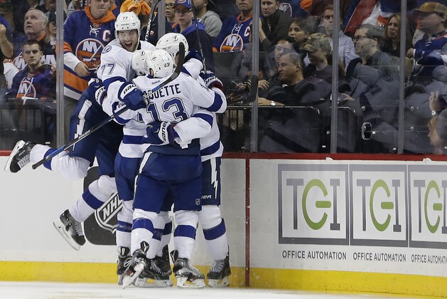 The Tampa Bay Lightning celebrate the game-winning goal by center Brian Boyle against the New York Islanders during the overtime period of Game 3 of the NHL hockey Stanley Cup Eastern Conference semifinals, Tuesday, May 3, 2016, in New York. The Lightning won 5-4. (AP Photo/Frank Franklin II)