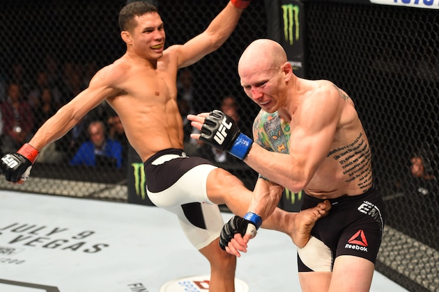 ROTTERDAM, NETHERLANDS - MAY 08:  (L-R) Jon Tuck kicks Josh Emmett in their lightweight bout during the UFC Fight Night event at Ahoy Rotterdam on May 8, 2016 in Rotterdam, Netherlands. (Photo by Josh Hedges/Zuffa LLC/Zuffa LLC via Getty Images)