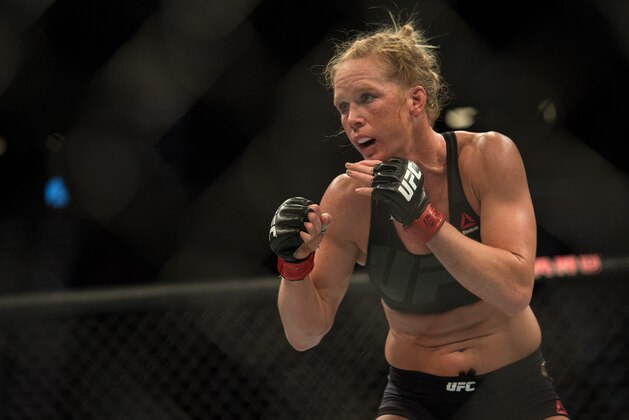 LAS VEGAS, NV - MARCH 5:   (R-L) Holly Holm circles Miesha Tate during their women's bantamweight championship  bout during the UFC 196 in the MGM Grand Garden Arena on March 5, 2016 in Las Vegas, Nevada. (Photo by Brandon Magnus/Zuffa LLC/Zuffa LLC via Getty Images)