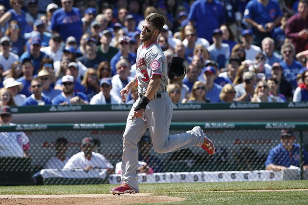 Washington Nationals' Bryce Harper scores on a double by Ryan Zimmerman against the Chicago Cubs during the third inning of a baseball game Sunday, May 8, 2016, in Chicago. (AP Photo/Nam Y. Huh)