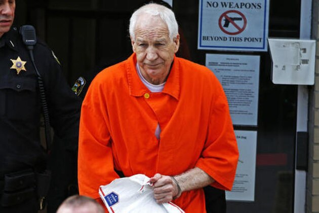 Former Penn State University assistant football coach Jerry Sandusky leaves the Centre County Courthouse after a hearing of arguments on his request for an evidentiary hearing as he seeks a new trial in Bellefonte, Pa., Monday, May 2, 2016. (AP Photo/Gene J. Puskar)
