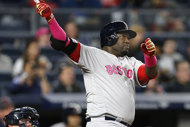 New York Yankees catcher Brian McCann, left, and Boston Red Sox designated hitter David Ortiz watch Ortiz's seventh-inning, solo home run off New York Yankees starting pitcher Luis Severino in a baseball game at Yankee Stadium in New York, Sunday, May 8, 2016. (AP Photo/Kathy Willens)